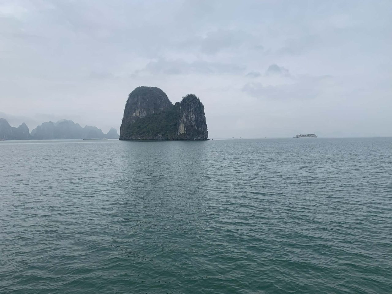 Scenic limestone karst islet within the iconic landscape of Hạ Long Bay in Vietnam.
